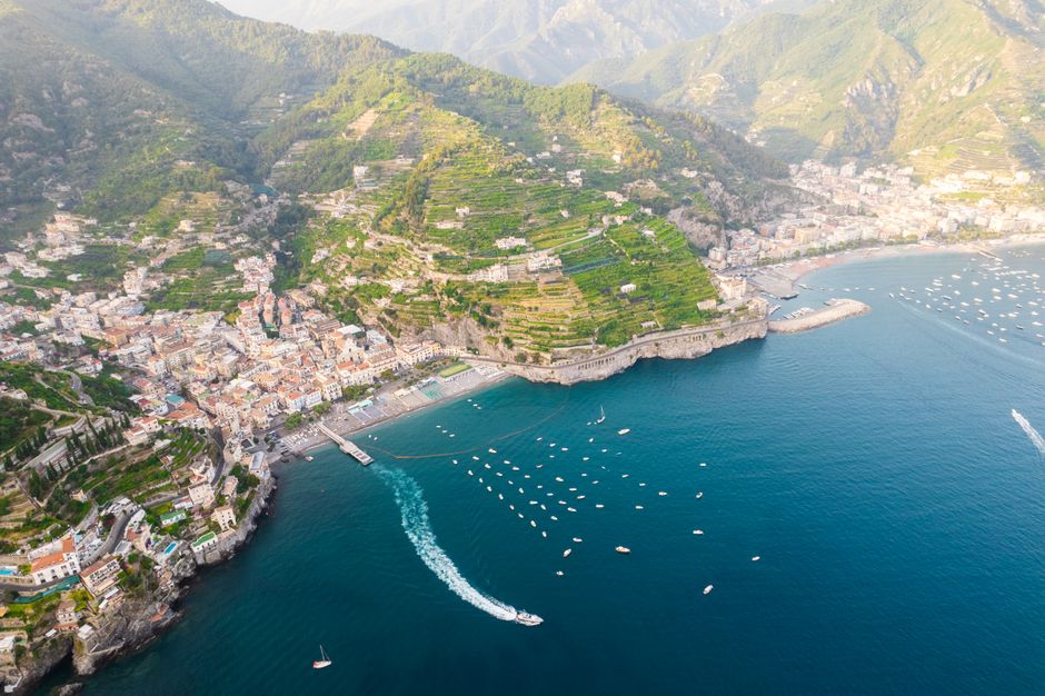 Stunning aerial view of Amalfi coastline, showcasing the vibrant landscape and serene sea.