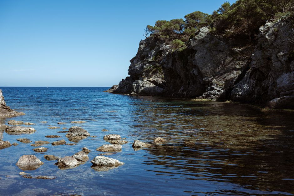 Beautiful rocky coastline in Provence-Alpes-Côte d'Azur, France, with clear blue water.